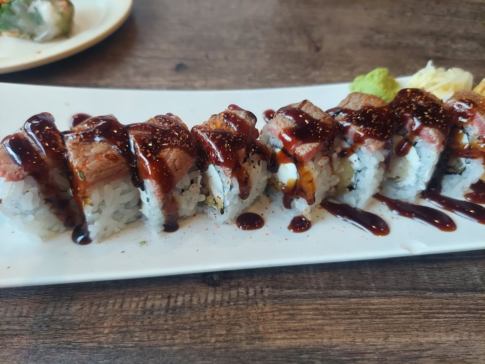 Plated sushi rolls on a clean table.