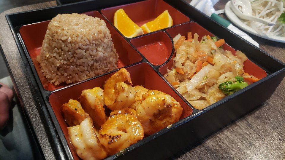 Mixed Japanese and Thai dishes ready to serve.